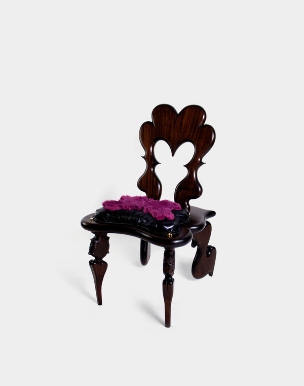 Quelaag Chair is a decorative wooden chair with a heart-shaped backrest on a white background